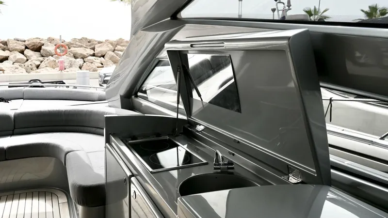 Oxygen III Yacht Photos Pics Luxurious 2007 Pershing 56 yacht interior with sleek kitchen and seating area.