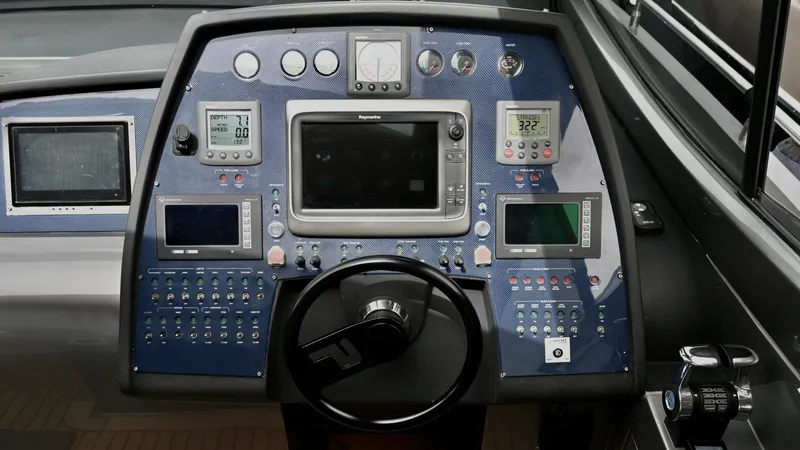 Oxygen III Yacht Photos Pics Control panel of a 2007 Pershing 56 yacht, featuring navigation and monitoring instruments.