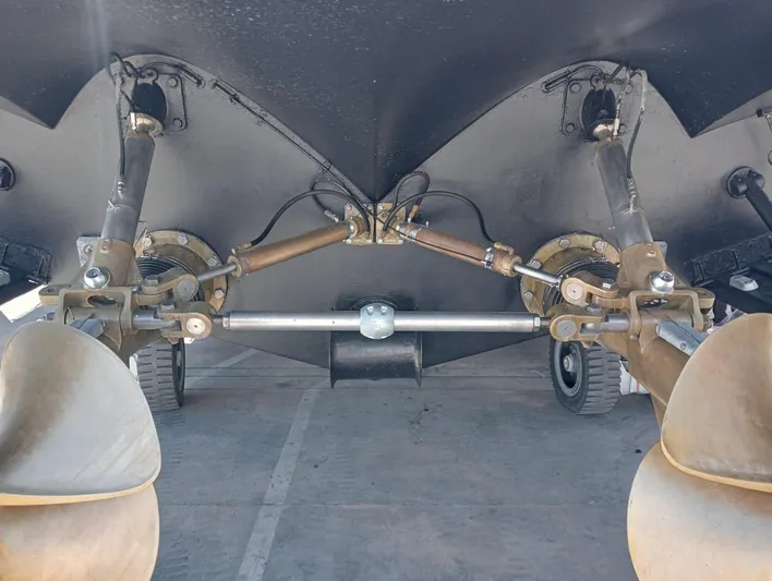 Oxygen III Yacht Photos Pics Underside view of 2007 Pershing 56 yacht showing propellers and steering mechanism.