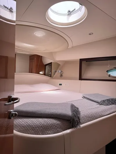 Oxygen III Yacht Photos Pics Luxurious interior cabin of a 2007 Pershing 56 yacht with modern design elements.