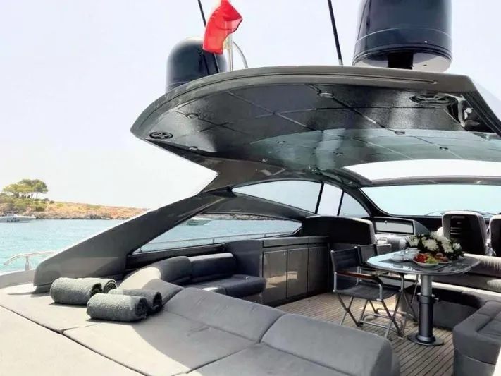 Oxygen III Yacht Photos Pics Luxurious 2007 Pershing 56 yacht interior with elegant seating and scenic ocean view.