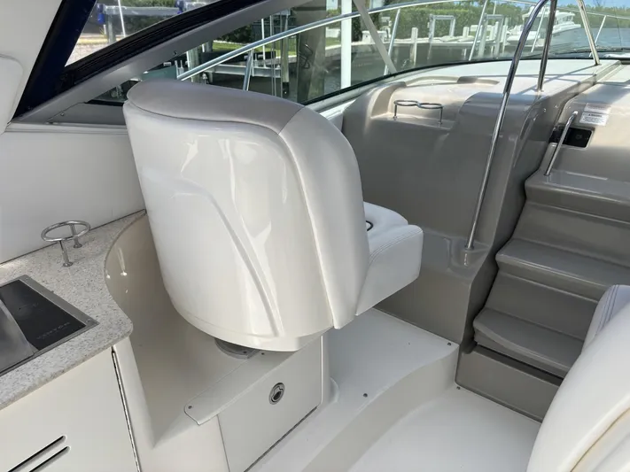 Mocaccino Yacht Photos Pics Interior of 2011 Sea Ray 350 Sundancer yacht with white seating and stairs.