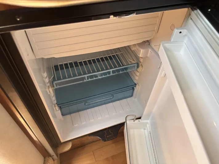 Mocaccino Yacht Photos Pics Empty refrigerator inside a 2011 Sea Ray 350 Sundancer boat.