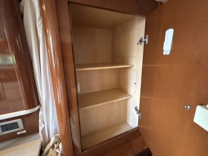 Mocaccino Yacht Photos Pics Empty wooden cabinet inside 2011 Sea Ray 350 Sundancer boat interior.