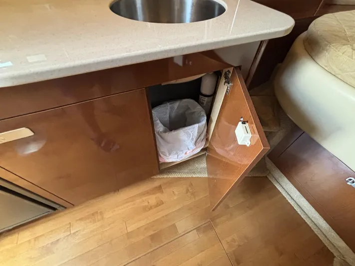 Mocaccino Yacht Photos Pics 2011 Sea Ray 350 Sundancer interior with open cabinet and sink.