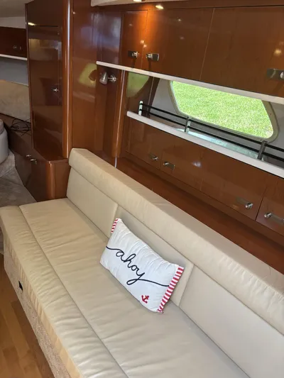 Mocaccino Yacht Photos Pics Interior of 2011 Sea Ray 350 Sundancer with beige seating and "ahoy" pillow.