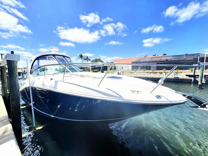 Mocaccino Yacht Photos Pics 2011 Sea Ray 350 Sundancer yacht docked under a clear blue sky.