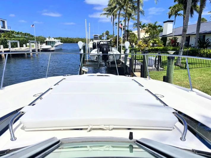 Mocaccino Yacht Photos Pics 2011 Sea Ray 350 Sundancer docked in a sunny marina with palm trees.