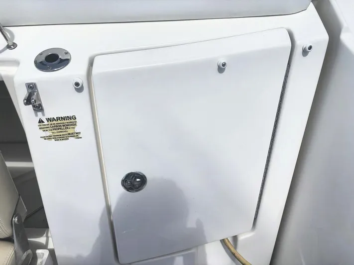 Mocaccino Yacht Photos Pics 2011 Sea Ray 350 Sundancer boat compartment door with warning label and latch.
