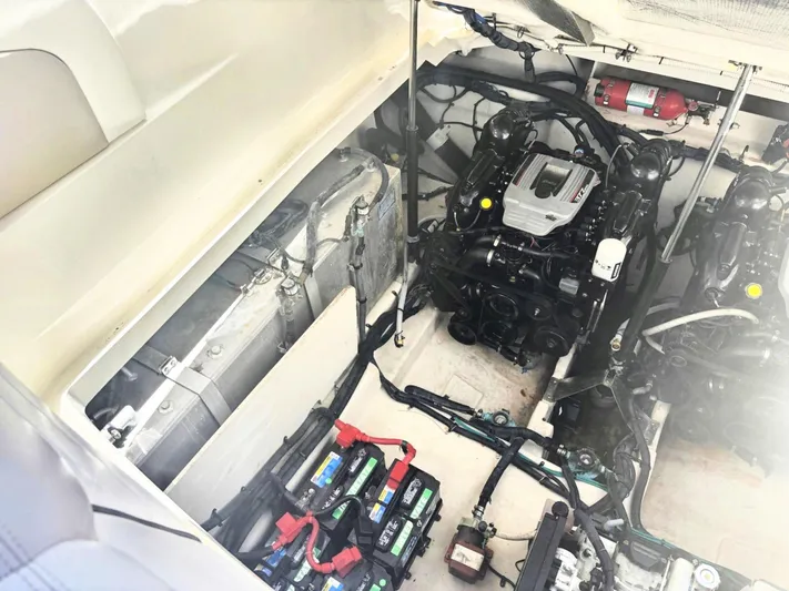 Mocaccino Yacht Photos Pics Engine compartment of a 2011 Sea Ray 350 Sundancer with visible batteries and machinery.
