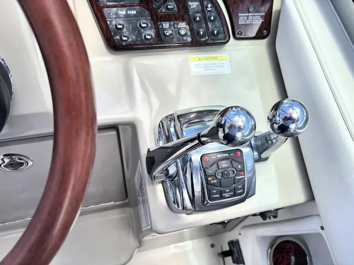 Mocaccino Yacht Photos Pics 2011 Sea Ray 350 Sundancer helm controls with dual throttle levers and control panel.