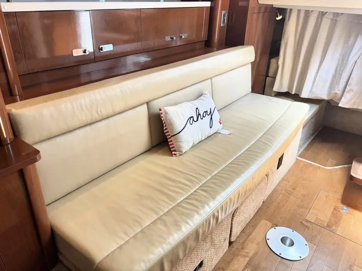 Mocaccino Yacht Photos Pics Interior of 2011 Sea Ray 350 Sundancer with beige leather sofa and nautical pillow.