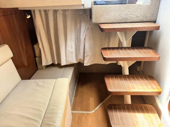 Mocaccino Yacht Photos Pics Interior of 2011 Sea Ray 350 Sundancer with wooden steps and beige seating.