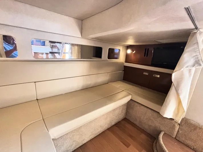 Mocaccino Yacht Photos Pics Interior of 2011 Sea Ray 350 Sundancer with beige seating and a mounted TV.