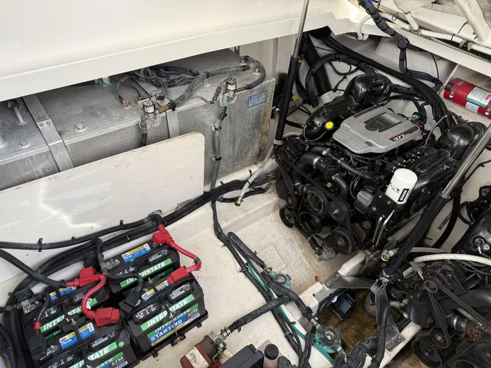 Mocaccino Yacht Photos Pics Engine compartment of 2011 Sea Ray 350 Sundancer with visible batteries and wiring.