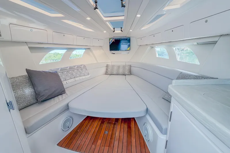  Yacht Photos Pics Luxurious interior of 2018 Intrepid 407 Cuddy boat with plush seating and modern design.