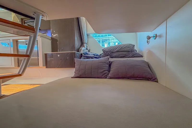  Yacht Photos Pics 2018 Intrepid 407 Cuddy interior with cozy bed and modern design.