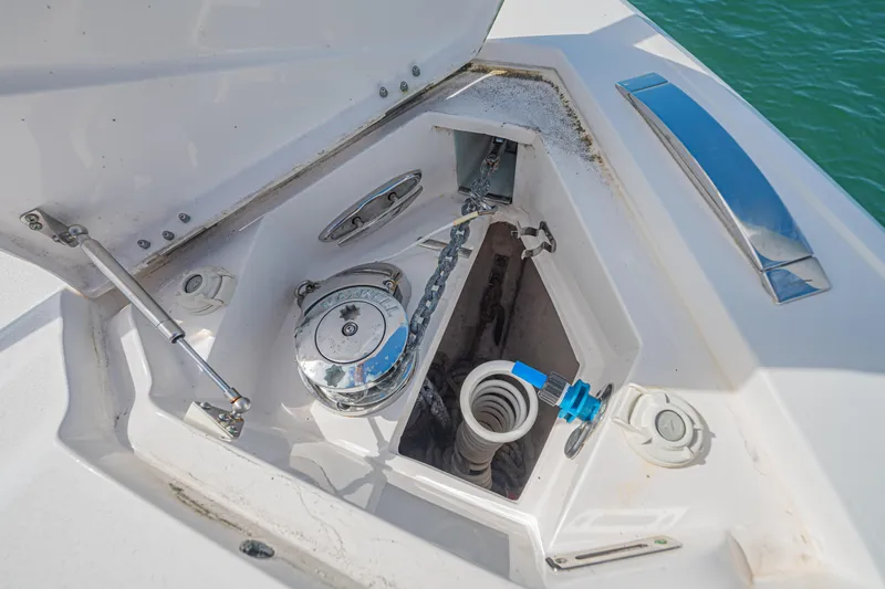  Yacht Photos Pics Anchor compartment of a 2018 Intrepid 407 Cuddy boat, featuring chain and winch.