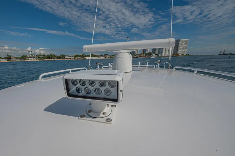  Yacht Photos Pics 2018 Intrepid 407 Cuddy boat with radar and lights on deck, coastal background.