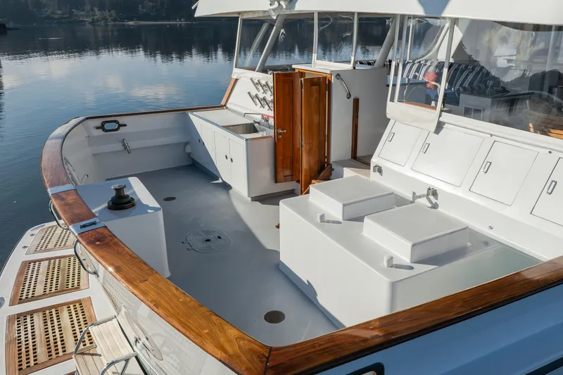 Silverado Yacht Photos Pics 1974 Willard 1201 boat deck with wooden accents and storage compartments.