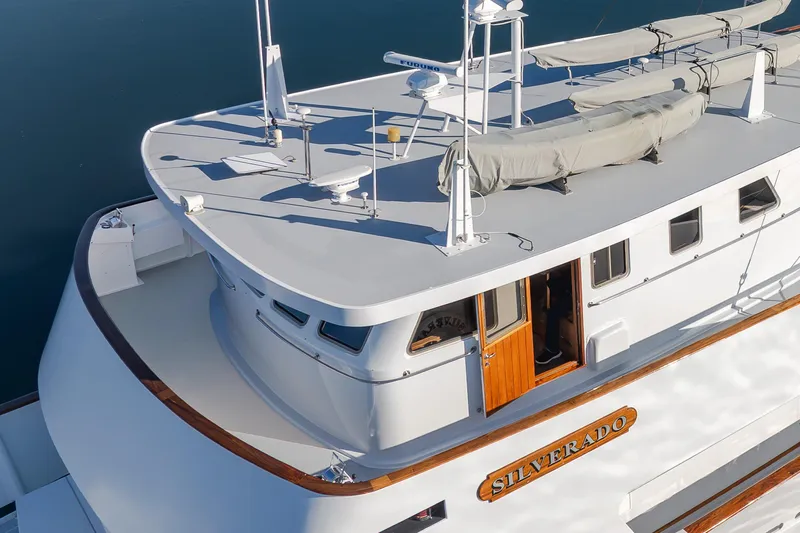 Silverado Yacht Photos Pics 1974 Willard 1201 yacht "Silverado" with sleek white design and wooden accents.