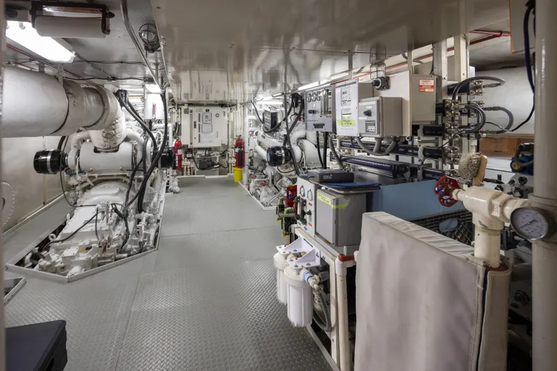 Silverado Yacht Photos Pics Engine room of a 1974 Willard 1201, featuring machinery and control panels.