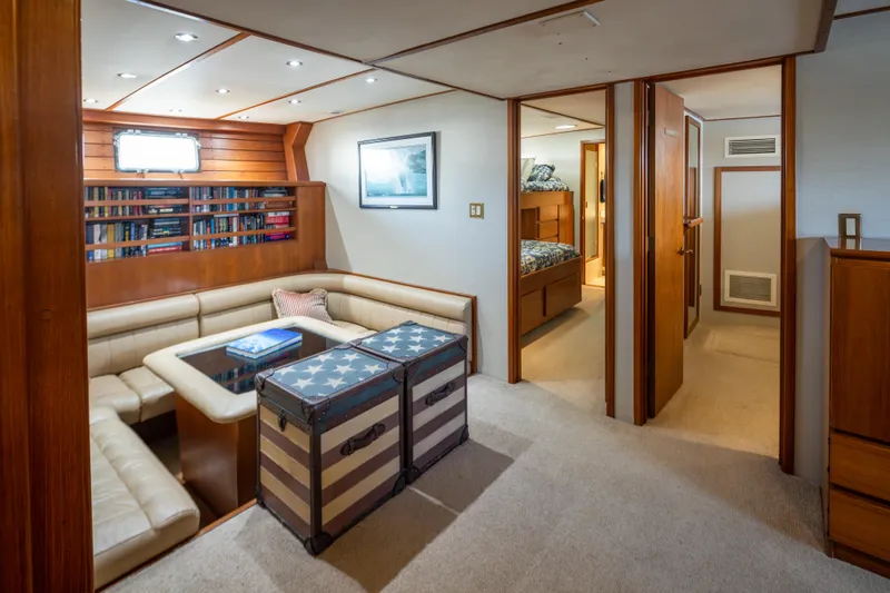 Silverado Yacht Photos Pics Luxurious 1974 Willard 1201 yacht interior with cozy seating, bookshelves, and nautical decor.