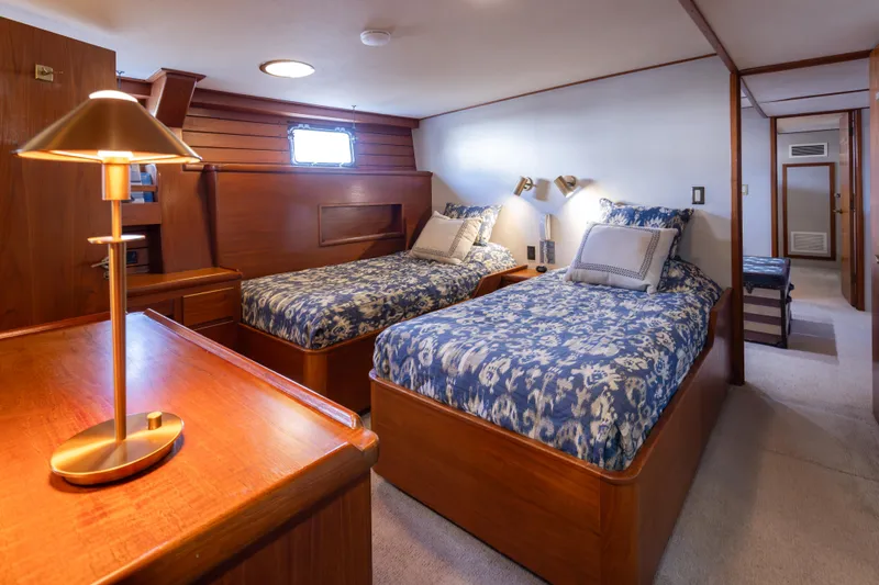 Silverado Yacht Photos Pics Luxurious 1974 Willard 1201 yacht cabin with twin beds and elegant wooden furnishings.