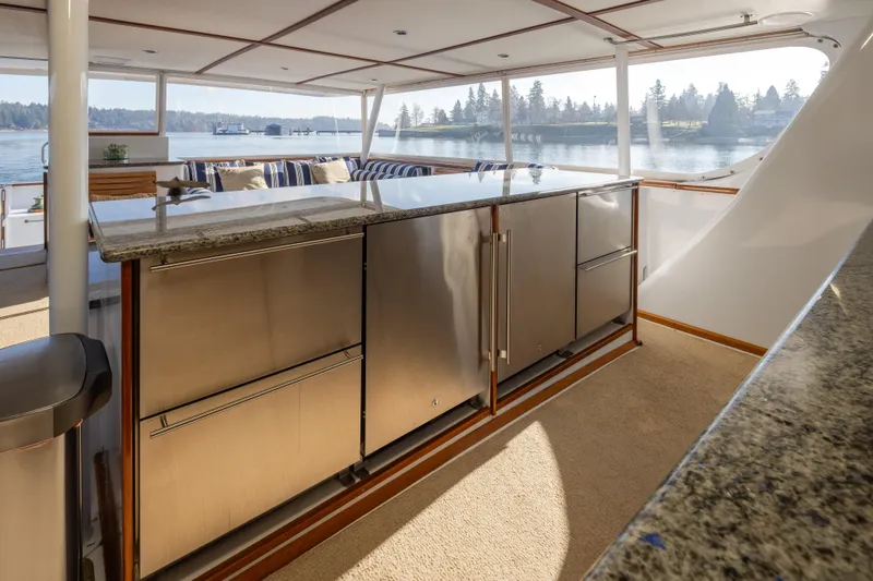 Silverado Yacht Photos Pics Luxurious 1974 Willard 1201 yacht interior with modern kitchen and scenic water view.