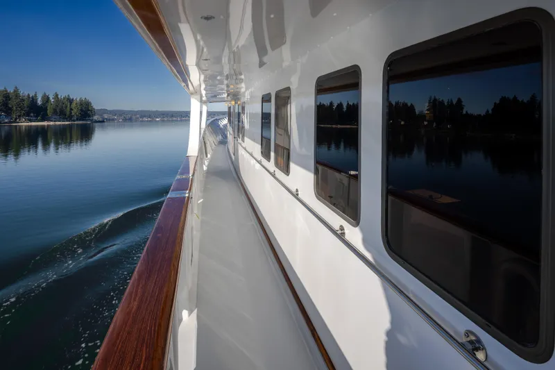 Silverado Yacht Photos Pics Side view of 1974 Willard 1201 yacht cruising on a calm lake.