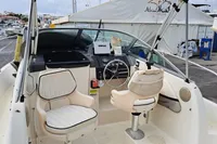 2000 Bayliner 2052 Trophy Walkaround DX/LX boat interior with steering wheel and seating.