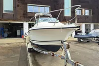 2000 Bayliner 2052 Trophy Walkaround DX/LX on trailer in marina setting.