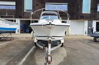 2000 Bayliner 2052 Trophy Walkaround DX/LX on trailer in marina setting.