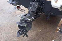 Bayliner 2052 Trophy Walkaround DX/LX 2000 boat stern with outboard motor and ladder.