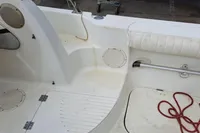 Interior of a 2000 Bayliner 2052 Trophy Walkaround DX/LX boat, featuring seating and storage.