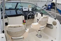 2000 Bayliner 2052 Trophy Walkaround DX/LX boat interior with steering wheel and seating.