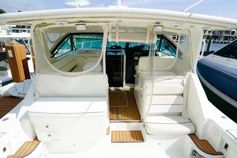 Sommertime Yacht Photos Pics 2005 Tiara Yachts 3800 Open, luxurious interior view with white seating and wood accents.