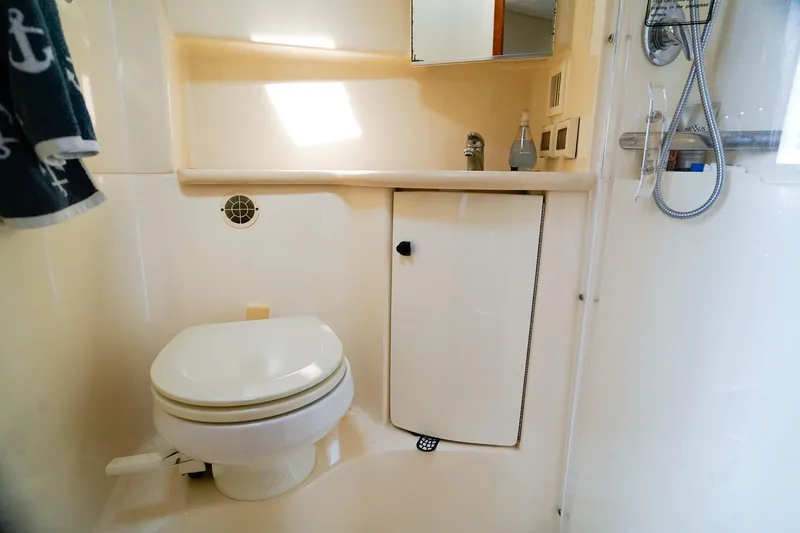 Sommertime Yacht Photos Pics Bathroom interior of 2005 Tiara Yachts 3800 Open, featuring toilet and shower.