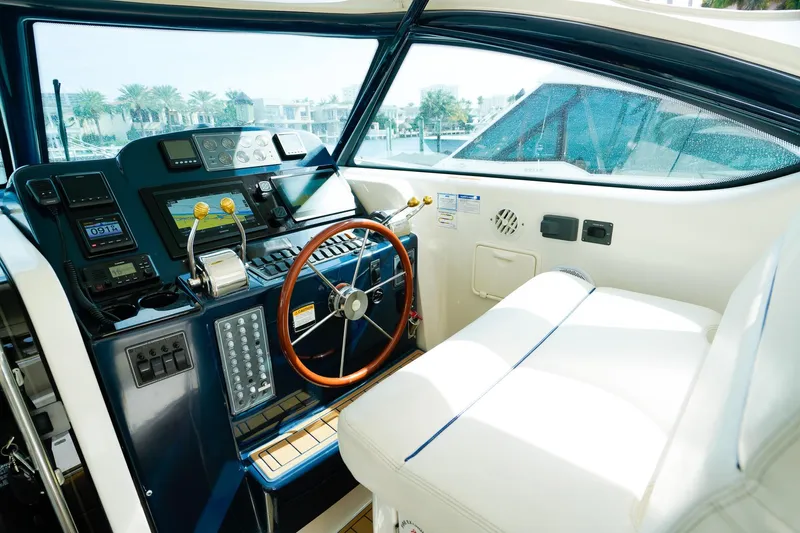 Sommertime Yacht Photos Pics 2005 Tiara Yachts 3800 Open helm with modern controls and luxurious seating.