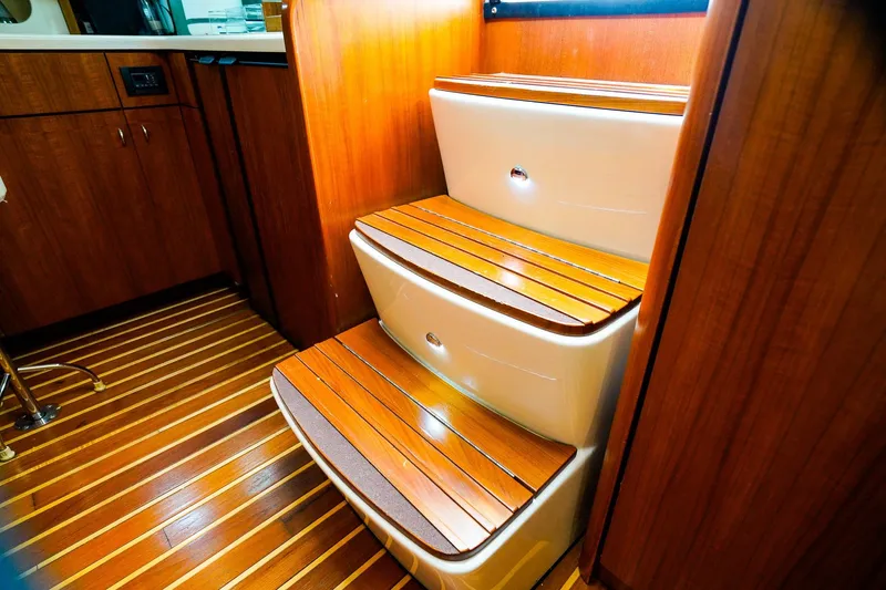 Sommertime Yacht Photos Pics Interior of 2005 Tiara Yachts 3800 Open, featuring wooden steps and cabinetry.