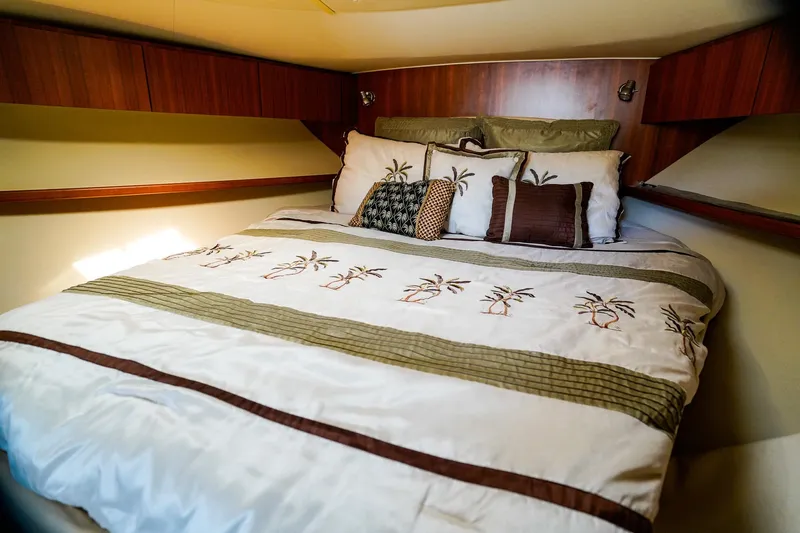 Sommertime Yacht Photos Pics Cozy bedroom in 2005 Tiara Yachts 3800 Open with palm-themed bedding.