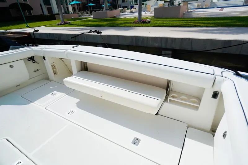 Sommertime Yacht Photos Pics 2005 Tiara Yachts 3800 Open boat interior with white seating and storage compartments.