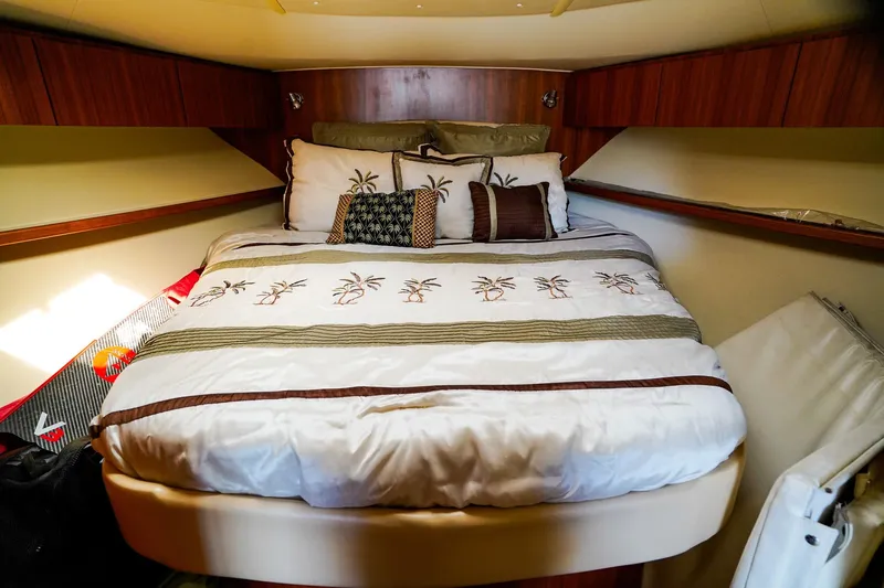 Sommertime Yacht Photos Pics Cozy bedroom interior of 2005 Tiara Yachts 3800 Open with palm-themed bedding.