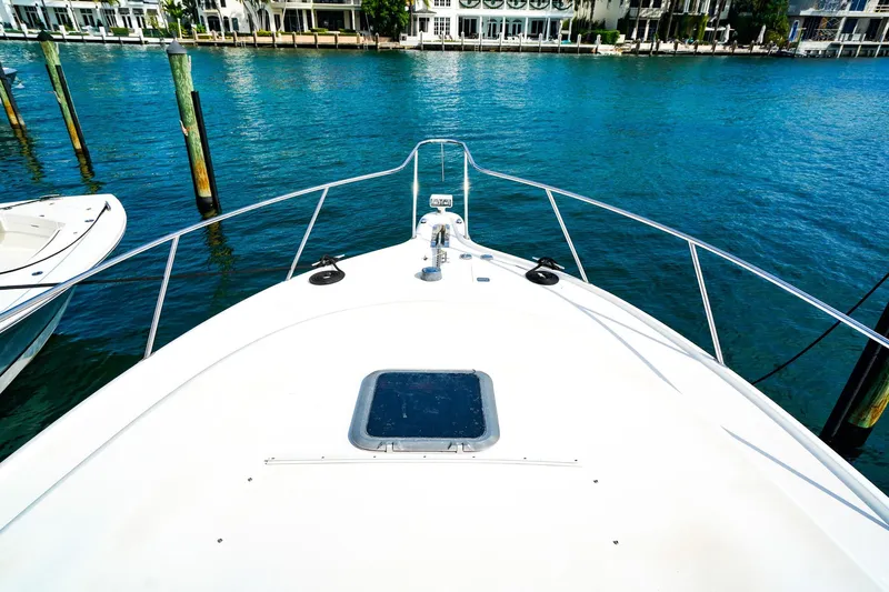 Sommertime Yacht Photos Pics Bow view of 2005 Tiara Yachts 3800 Open on clear blue water.