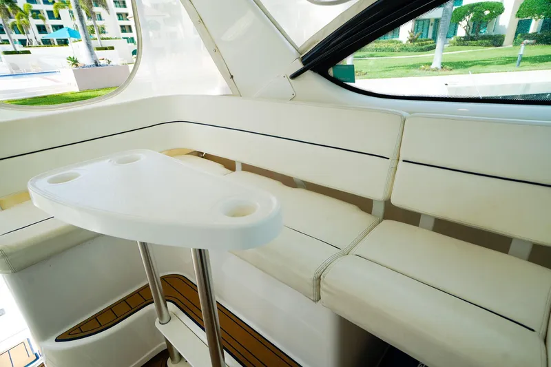 Sommertime Yacht Photos Pics Interior of 2005 Tiara Yachts 3800 Open with white seating and table.