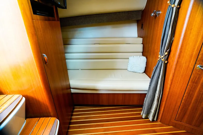 Sommertime Yacht Photos Pics 2005 Tiara Yachts 3800 Open interior with wooden finish and cushioned seating.