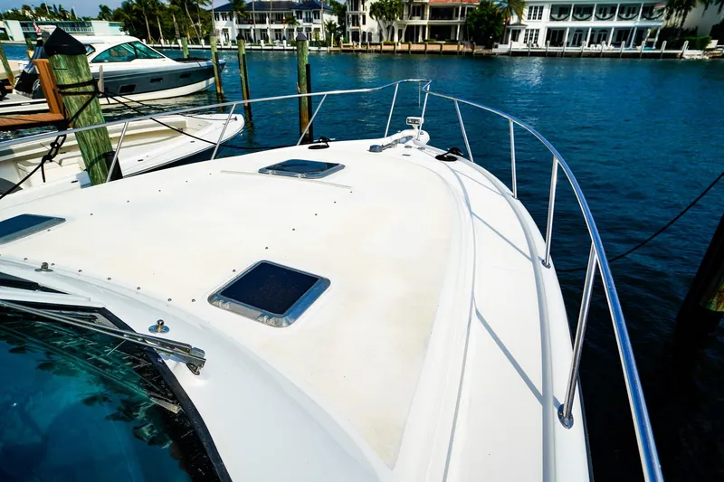 Sommertime Yacht Photos Pics 2005 Tiara Yachts 3800 Open docked, showcasing sleek deck and waterfront view.