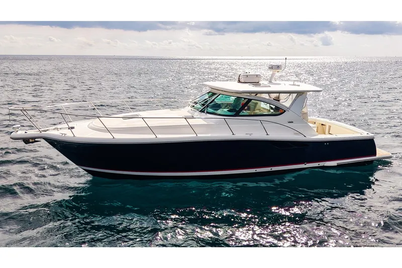 Sommertime Yacht Photos Pics 2005 Tiara Yachts 3800 Open cruising on open water under a cloudy sky.