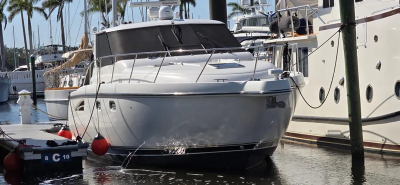  Yacht Photos Pics 2004 Tiara Yachts Sovran docked at marina, surrounded by other boats.