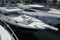 Nimbus 350 Coupe 2006 yacht docked at marina, surrounded by other boats, sunny day.